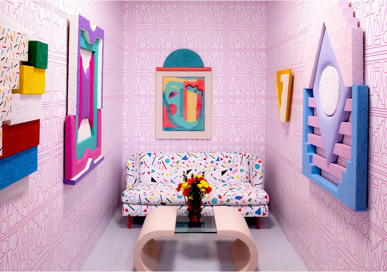 Leah Guadagnoli's lively living room is set up for visitors to interact with tactile geometric components, which play perfectly off the custom wallpaper we worked up with her. If you're interested in learning more or purchasing this design please give us a call.